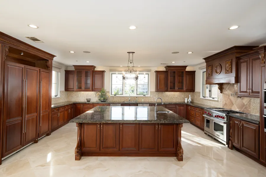 Gourmet kitchen with grand center island and Wolf range